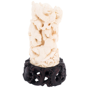 Mammoth tusk sculpture "Bears" on a stand