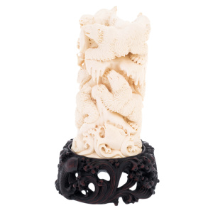 Mammoth tusk sculpture "Bears" on a stand