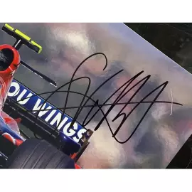 Фото с автографом гонщика Себастьяна Феттеля