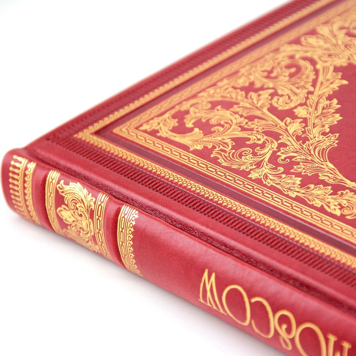 The book is a leather-bound photo album "Moscow" in English