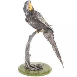 Silver sculpture "Parrot" on a marble stand