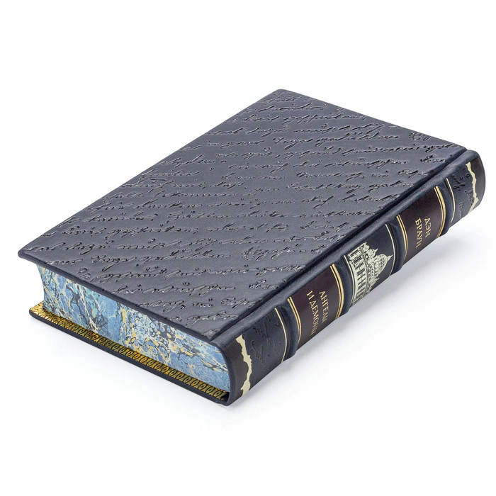 A leather-bound book by Dan Brown. Angels and Demons"