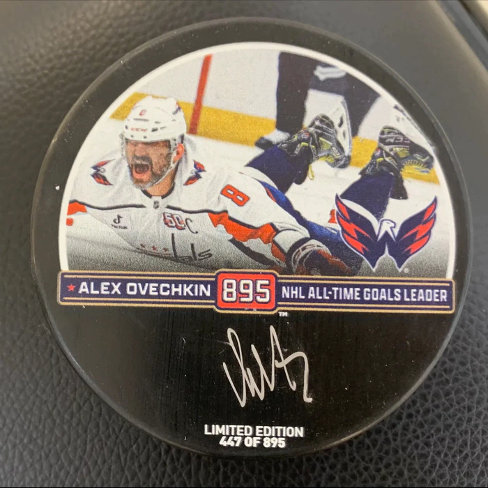 An autographed puck by hockey player Alexander Ovechkin