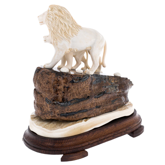 Sculpture of mammoth tooth, moose horn and mahogany "Lion and lioness on a rock"