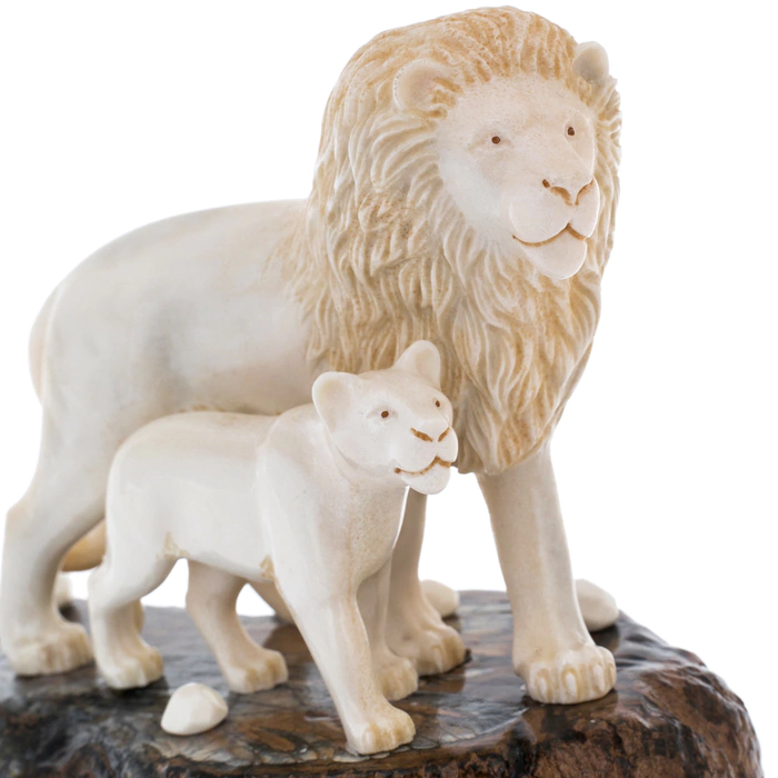Sculpture of mammoth tooth, moose horn and mahogany "Lion and lioness on a rock"