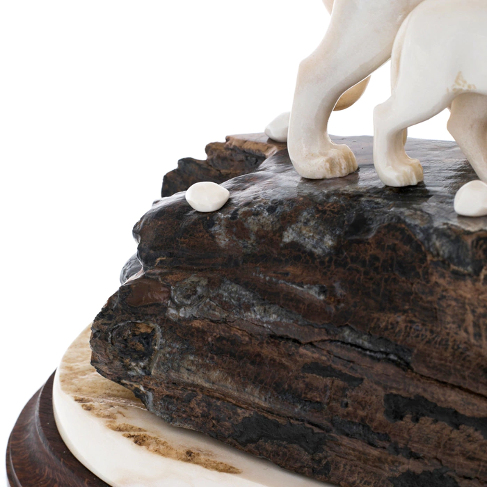 Sculpture of mammoth tooth, moose horn and mahogany "Lion and lioness on a rock"