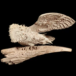 Highly artistic sculpture "Barn Owl" made of mammoth tusk
