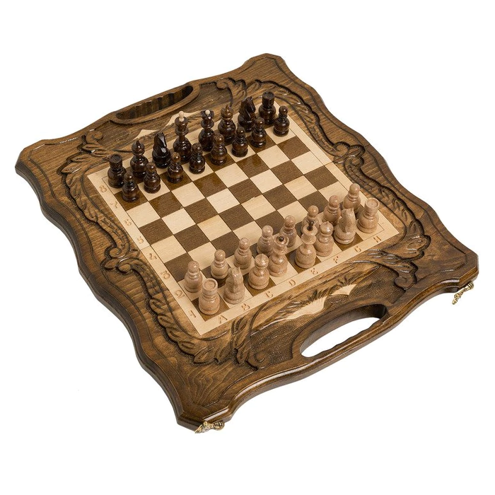 A small carved "Mountain Peaks" game set (chess, backgammon and checkers) with a handle