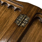 A small carved "Mountain Peaks" game set (chess, backgammon and checkers) with a handle