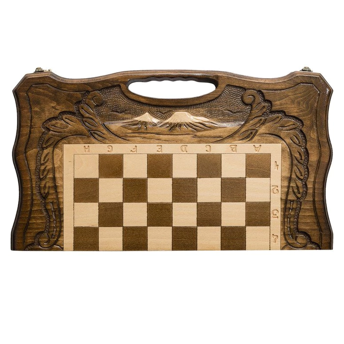 A small carved "Mountain Peaks" game set (chess, backgammon and checkers) with a handle