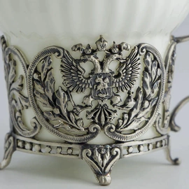 Silver tea cup "Coat of Arms" with a spoon, blackening