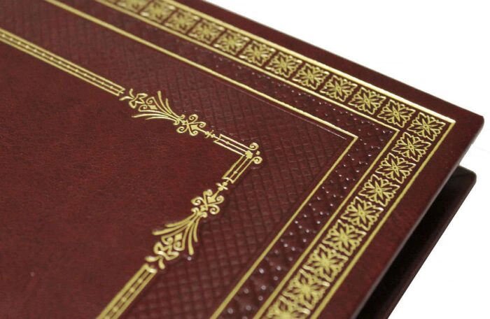 The leather-bound book "The history of cold steel: cords, daggers, knives, bayonets"