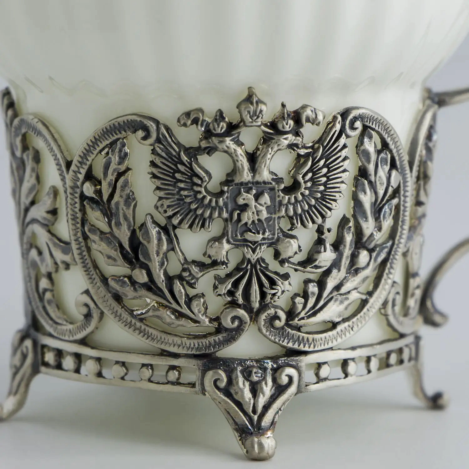 Silver tea cup "Coat of Arms" with a spoon, blackening